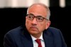 FILE - In this Dec. 6, 2019, file photo, U.S. Soccer President Carlos Cordeiro presides over a meeting of the U.S. Soccer Board of Directors in Chicago. Cordeiro resigned Thursday night, March 12, 2020, three days after the organization filed legal papers in a gender discrimination claiming women players had less physical ability and responsibility than men. (AP Photo/Charles Rex Arbogast, File)