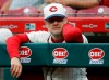 FILE - Cincinnati Reds manager David Bell watches from the dugout during the second inning of a baseball game against the Texas Rangers in Cincinnati, in this Saturday, June 15, 2019, file photo. The Cincinnati Reds will begin the 2021 season without two of last year’s most important pitchers — National League Cy Young Award winner Trevor Bauer and closer Raisel Iglesias. How manager David Bell will work around those blockbuster departures is a major question as his pitchers begin throwing this week in spring training. (AP Photo/John Minchillo, File)