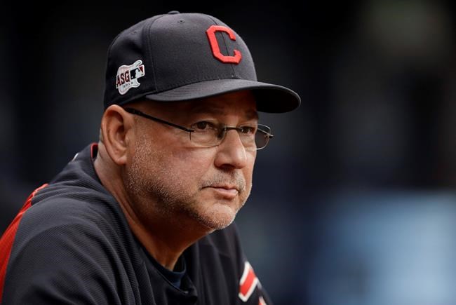FILE - In this Sept. 1, 2019, file photo, Cleveland Indians manager Terry Francona watches during the first inning of the team's baseball game against the Tampa Bay Rays in St. Petersburg, Fla. Cleveland's three major professional sports franchises--the Browns, Cavaliers and Indians--are teaming up to fight social injustice. One day after the NBA postponed playoff games _ and other leagues followed suit--amid a player-led boycott to protest the shooting of a Black man by police in Wisconsin, the Cleveland teams announced their alliance to “develop a sustainable and direct strategy to address social injustice facing the city and all Northeast Ohio communities.” (AP Photo/Chris O'Meara, File)