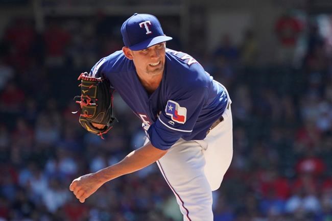 FILE - In this Sept. 26, 2019, file photo, Texas Rangers starting pitcher Mike Minor (23) throws against the Boston Red Sox during a baseball game in Arlington, Texas. All-Star lefty Mike Minor feels like the Texas Rangers will be in pretty good shape if he and hard-throwing right-hander Lance Lynn can again do what they did last season. (AP Photo/Louis DeLuca, File)