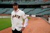 FILE - In this Nov. 13, 2019, file photo, San Francisco Giants manager Gabe Kapler stands on the field and looks out at Oracle Park in San Francisco after being introduced. Kapler knew from the get-go when named San Francisco's new manager the pressure he would feel taking over as leader of a franchise that has had so many good ones in recent memory. (AP Photo/Eric Risberg, File)
