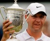 FILE - In this June 22, 2009, file photo, Lucas Glover holds his trophy after winning the U.S. Open Golf Championship at Bethpage State Park's Black Course in Farmingdale, N.Y. Glover is the last qualifier to win the U.S. Open. The USGA announced exemption categories Thursday, June 25, 2020, because the COVID-19 pandemic eliminated any chance of holding qualifiers across the country. (AP Photo/Charles Krupa, File)