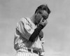FILE - New York Yankees' Lou Gehrig wipes away a tear while speaking during a sold-out tribute at Yankee Stadium in New York, in this July 4, 1939, file photo. Major League Baseball will hold its first Lou Gehrig Day on June 2, 2021, adding Gehrig to Jackie Robinson and Roberto Clemente on the short list of players honored throughout the big leagues. (AP Photo/Murray Becker, File)