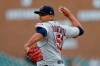 FILE - In this Sunday, Sept. 1, 2019 file photo, Minnesota Twins relief pitcher Brusdar Graterol throws his first MLB pitch during the ninth inning of a baseball game against the Detroit Tigers in Detroit. With less than a week before pitchers and catchers were scheduled to report to spring training, the Red Sox sent Mookie Betts and David Price to the Los Angeles Dodgers in a deal that brought outfielder Alex Verdugo and Twins pitching prospect Brusdar Graterol to Boston. (AP Photo/Carlos Osorio, File)