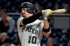 FILE - In this Sept. 5, 2019, file photo, Pittsburgh Pirates' Bryan Reynolds follows through on a solo home run off Miami Marlins relief pitcher Jarlin Garcia during the ninth inning of a baseball game in Pittsburgh. Ask the Pittsburgh Pirates outfielder how he's been able to hit at every level -- from college through the minors to the majors, where he finished fourth in NL Rookie of the Year race in 2019 -- and he shrugs. His teammates, however, know better. Underneath his 