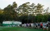 FILE - In this April 11, 2019, file photo, fans walk along the first hole during the first round for the Masters golf tournament in Augusta, Ga. The Masters, the major known as much for the roars of the crowd as the raw beauty of Augusta National, will be on mute this year. The club decided Wednesday, Aug. 12, 2020, there will be no spectators.(AP Photo/Charlie Riedel, File)