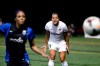 FILE - In this Aug. 24, 2014, file photo, Washington Spirit's Toni Pressley (3) yells as Seattle Reign FC's Sydney Leroux follows the ball during the first half of a NWSL semifinal soccer match in Seattle. Pressley was looking forward to a comeback season with the Orlando Pride this year after overcoming breast cancer. But then life threw the veteran defender another curve with the coronavirus pandemic and the impact it would ultimately have on the Pride, who were left out of this summer's Challenge Cup tournament. (AP Photo/Elaine Thompson, File)