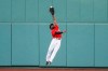 FILE - Boston Red Sox center fielder Jackie Bradley Jr. makes a leaping catch on a ball hit by Toronto Blue Jays' Rowdy Tellez during the sixth inning of the first baseball game of a doubleheader at Fenway Park in Boston, in this Friday, Sept. 4, 2020, file photo. Free-agent outfielder Jackie Bradley Jr. is joining the Milwaukee Brewers, agreeing to the parameters of a $24 million, two-year contract, a person familiar with the negotiations told The Associated Press. The person spoke on condition of anonymity Thursday, March 4, 2021, because the details of the agreement were still being negotiated and the deal is subject to a successful physical.(AP Photo/Winslow Townson, File)