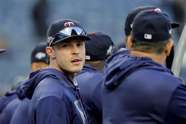 FILE - In this Oct. 4, 2019, file photo, Minnesota Twins' Max Kepler waits to take batting practice before Game 1 of an American League Division Series baseball game against the New York Yankees in New York. Twins right fielder Max Kepler didn’t get to watch a lot of major league baseball growing up in Germany. The games he did did see included many Boston Red Sox-New York Yankees matchups, which caused him to become a big fan of Derek Jeter. “I loved watching Jeter, even though I’m a lefty and the complete opposite of what he was,” Kepler said Tuesday, Feb. 18, 2020, before Minnesota’s second full-squad workout. “He was the guy I really looked up to.” (AP Photo/Seth Wenig, File)