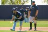 FILE - Milwaukee Brewers' Keston Hiura, left, and Daniel Vogelbach work on fielding drills during a spring training baseball workout in Phoenix, in this Tuesday, Feb. 23, 2021, file photo. Hiura had been Milwaukee’s starting second baseman for the last two years but is moving over to first as the Brewers make room for newly acquired Kolten Wong at second. (AP Photo/Jae C. Hong, File)
