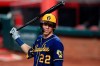 FILE - Milwaukee Brewers' Christian Yelich waits to bat during a baseball game against the Cincinnati Reds in Cincinnati, in this Monday, Sept. 21, 2020, file photo. The average Major League Baseball salary dropped for an unprecedented third straight year, even before the shortened season caused by the novel coronavirus pandemic. Last year’s drop showed the widening imbalance between top stars and other players. The average fell despite Gerrit Cole, Stephen Strasburg, Anthony Rendon and Christian Yelich all starting long-term contracts guaranteeing $215 million or more. (AP Photo/Aaron Doster, File)