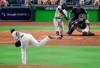 FILE - Boston Red Sox's Jackie Bradley Jr., hits a two-run home run off Houston Astros pitcher Josh James during the sixth inning in Game 4 of a baseball American League Championship Series in Houston, in this Wednesday, Oct. 17, 2018, file photo. Major League Baseball wants to see if moving back the pitcher's mound will increase offense. MLB will experiment with a 12-inch greater distance between the mound and home plate during a portion of the Atlantic League season in an effort to decrease strikeouts and increase offense. The pitching rubber will be moved back to 61 feet, 6 inches starting Aug. 3. (AP Photo/Lynne Sladky, File)