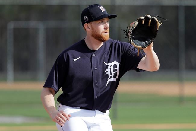 FILE - In this Feb. 15, 2020, file photo, Detroit Tigers' Spencer Turnbull takes part in a drill during a spring training baseball workout in Lakeland, Fla. Christin Stewart homered in the top of the 10th inning to lift Detroit to a win in its season opener last year. A few days later, Spencer Turnbull took the mound for the Tigers as the starting pitcher for their first home game. Those are moments each player can look back on with pride, but both enter 2020 with a lot still to prove. (AP Photo/Frank Franklin II, File)
