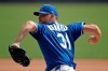 FILE - Kansas City Royals pitcher Ian Kennedy throws during baseball practice at Kauffman Stadium in Kansas City, Mo., in this Friday, July 3, 2020, file photo. Veteran right-hander Ian Kennedy has signed a minor league contract with the Texas Rangers, and will be in major league spring training with a chance to be compete for a spot in their bullpen. New Rangers general manager Chris Young, a former teammate of Kennedy's in Kansas City, said Tuesday, Feb. 23, 2021, that the 36-year-old Kennedy brings a veteran presence after playing for four different teams over 14 big league seasons. (AP Photo/Charlie Riedel, File)