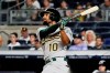 FILE - In this Aug. 30, 2019, file photo, Oakland Athletics' Marcus Semien watches his home run during the ninth inning of the team's baseball game against the New York Yankees in New York. Following a career year, Semien was rewarded Friday, Jan. 10, with a $13 million, one-year contract that avoids arbitration and gives him a raise of $7.1 million. Semien played all 162 games for the first time in 2019 to help the A's win 97 games for a second straight season and the AL's top wild card. He finished third in MVP voting after putting up several personal bests: 33 homers and 92 RBIs while hitting .285. (AP Photo/Frank Franklin, File)