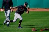Cleveland Indians outfielder Eddie Rosario reaches out to catch a baseball during a spring training baseball practice Monday, Feb. 22, 2021, in Goodyear, Ariz. Once adversaries, Eddie Rosario and Indians manager Terry Francona are now allies. So when Rosario, who spent the past six seasons with Minnesota, sat down with Francona at spring training camp in Arizona for the first time last week, the free-swinging outfielder received a warm, if not awkward, welcome.(AP Photo/Ross D. Franklin)