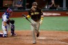 FILE - In this Aug. 17, 2020, file photo, Texas Rangers catcher Jose Trevino kneels by the plate as San Diego Padres' Fernando Tatis Jr. watches his grand slam during the eighth inning of a baseball game in Arlington, Texas. (AP Photo/Tony Gutierrez, File)