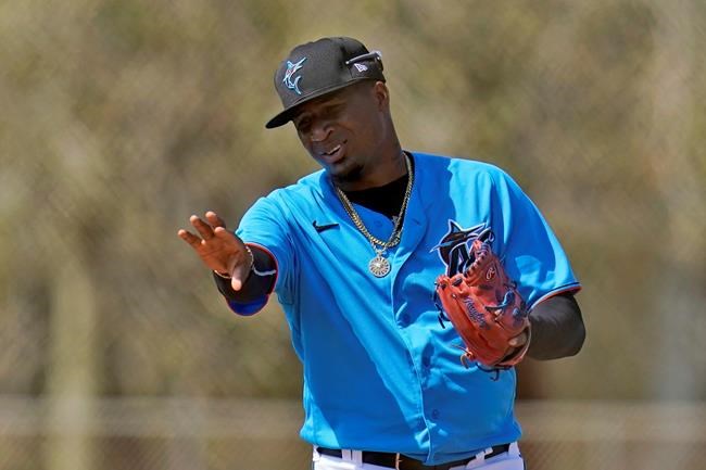 FILE - Miami Marlins pitcher Sixto Sanchez gestures while talking to a teammate during spring training baseball practice in Jupiter, Fla., in this Friday, Feb. 26, 2021, file photo. None of the eight pitchers in the mix for the rotation is older than 25. (AP Photo/Jeff Roberson, File)