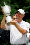 FILE - In this June 22, 2009, file photo, Lucas Glover holds his trophy after winning the U.S. Open Golf Championship at Bethpage State Park's Black Course in Farmingdale, N.Y. The COVID-19 pandemic, which already has postponed the U.S. Open from June to September, has forced the USGA to do away with qualifying for the first time since 1924. (AP Photo/Morry Gash)