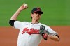 FILE - Cleveland Indians starting pitcher Shane Bieber delivers in the first inning in a baseball game against the Minnesota Twins in Cleveland, in this Tuesday, Aug. 25, 2020, file photo. For the Indians, the changes go beyond just dropping their debated name. (AP Photo/Tony Dejak, File)
