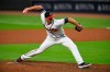 FILE - Atlanta Braves pitcher Darren O'Day works against the Miami Marlins during a baseball game in Atlanta, in this Monday, Sept. 21, 2020, file photo. The Yankees quickly found a replacement for their bullpen, agreeing to a $2.5 million, one-year contract with submarining right-hander Darren O’Day, a person familiar with the negotiations told The Associated Press on Wednesday, Jan. 27, 2021. (AP Photo/John Amis, File)