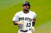 FILE - Pittsburgh Pirates' Ke'Bryan Hayes rounds third base after hitting a solo home run off Chicago Cubs starting pitcher Kyle Hendricks during the first inning of a baseball game in Pittsburgh, in this Wednesday, Sept. 23, 2020, file photo. A year ago, Ke'Bryan Hayes entered Pittsburgh Pirates spring training trying to bide his time until he made his big-league debut. Now the third baseman finds himself as the de facto face of the franchise after an abbreviated breakout rookie season. (AP Photo/Gene J. Puskar, File)