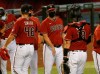 FILE - Arizona Diamondbacks baseball team manager Torey Lovullo, center, greets his players after their win over the Colorado Rockies in Phoenix, in this Sunday, Sept. 27, 2020, file photo. The 55-year-old Lovullo enters his fifth year with the Diamondbacks — and the final year of his current contract — under a substantial amount of scrutiny. Lovullo shrugged off any notion that he's feeling added pressure on Wednesday, Feb. 17, 2021, when the team's pitchers and catchers went through their first workouts in Scottsdale, Arizona. (AP Photo/Darryl Webb, File)