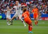 FILE - In this July 7, 2019, file photo, United States' Rose Lavelle, left, is challenged by Netherlands' Danielle Van De Donk during the Women's World Cup final soccer at the Stade de Lyon in Decines, outside Lyon, France. Twenty players have been named to the U.S. women's soccer team that will play for a spot in the Tokyo Olympics. Coach Andonovski announced the roster for the CONCACAF Olympic qualifying tournament Friday, Jan. 17, 2020. (AP Photo/David Vincent, File)