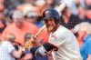 FILE - In this Sept. 30, 2018, file photo, San Francisco Giants Hunter Pence waits on deck club before batting against the Los Angeles Dodgers in the ninth inning of a baseball game in San Francisco. Pence is returning to the Giants, agreeing to a contract that will give the young club a veteran presence in both the outfield and clubhouse in a season of big change ahead. A person with direct knowledge of the deal said Friday, Feb. 7, 2020, that Pence had reached agreement pending a physical. The person spoke to The Associated Press on condition of anonymity because no announcement had been made. (AP Photo/John Hefti)