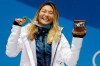 FILE - In this Feb. 13, 2018, file photo, women's halfpipe gold medalist Chloe Kim, of the United States, poses during the medals ceremony at the 2018 Winter Olympics in Pyeongchang, South Korea. Chloe Kim took some time off to heal her body and broaden her mind. Mission(s) accomplished, and now that she's back at her day job — best female athlete in the halfpipe — it looks as though she never left. Now 20 and with a year at Princeton under her belt, the Olympic champion is in the lineup for the Winter X Games, going for her fifth gold medal on the superpipe in Aspen on Saturday night, Jan. 30, 2021. (AP Photo/Morry Gash, File)