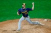 Milwaukee Brewers' pitcher Alex Claudio throws against the Minnesota Twins during a baseball game in Minneapolis, Tuesday, Aug. 18, 2020. Left-handed reliever Alex Claudio has agreed to a one-year, $1.125 million contract with the Los Angeles Angels. The Angels announced the deal Wednesday, Dec. 16, 2020.(AP Photo/Jim Mone)
