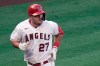 FILE - Los Angeles Angels' Mike Trout rounds the bases after hitting a two-run home run during the third inning of the first baseball game of a doubleheader against the Houston Astros in Anaheim, Calif., in this Saturday, Sept. 5, 2020, file photo. Mike Trout is back in spring training with the Angels to chase his first playoff victory. The three-time AL MVP is growing weary of hearing the annual questions about when he'll finally reach that career milestone. (AP Photo/Jae C. Hong, File)