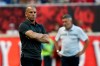 FILE - New York Red Bulls head coach Chris Armas, left, watches his team from the sideline while New York City FC head coach Domenec Torrent looks on during the second half of an MLS soccer match, Sunday, July 14, 2019, in Harrison, N.J. New York Red Bulls have fired coach Chris Armas after a little more than two years on the job. The MLS team also said Friday, Sept. 4, 2020, that assistant coach CJ Brown will not be back. (AP Photo/Steve Luciano, File)