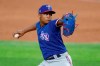 FILE - Texas Rangers pitcher Jose Leclerc throws to the plate during an intrasquad game baseball game at Globe Life Field in Arlington, Texas, in this Thursday, July 9, 2020, file photo. The Texas Rangers are expecting to be without one-time closer José Leclerc for an extended time because of right elbow soreness, the latest setback for a bullpen already missing another key late-inning arm for at least two months. General manager Chris Young said Monday, March 22, 2021, that Leclerc reported soreness after a recent outing, and the right-hander has returned to Texas to be evaluated by team physician Dr. Keith Meister. (AP Photo/Tony Gutierrez, File)