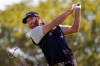 FILE - In this Saturday, Sept. 19, 2020, file photo, Dustin Johnson hits from the fourth tee during the third round of the U.S. Open Golf Championship, in Mamaroneck, N.Y. Dustin Johnson withdrew from the CJ Cup at Shadow Creek on Tuesday, Oct. 13, 2020, because of the coronavirus, the most prominent player since golf resumed in June to test positive. The PGA Tour said in a statement that Johnson notified officials he was experiencing COVID-19 symptoms and was given another test that came back positive. (AP Photo/John Minchillo, File)