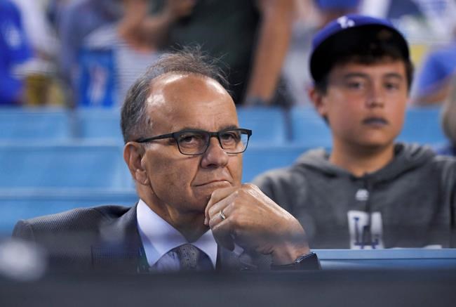 FILE - In this Oct. 3, 2019, file photo, Joe Torre watches during the first inning of Game 1 in baseball's National League Divisional Series between the Los Angeles Dodgers and the Washington Nationals in Los Angeles. Major League Baseball will have a new disciplinarian. Torre, who has headed baseball operations at the commissioner's office since 2011, is shifting to a role as special assistant to the commissioner. Former pitcher Chris Young will replace Torre as the person who decides suspensions and fines for on-field matters, such as intentionally hitting batters, charging the mound and fights. (AP Photo/Mark J. Terrill, File)