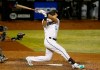FILE - Arizona Diamondbacks' Jake Lamb swings at a pitch during the seventh inning of a baseball game against the Oakland Athletics in Phoenix, in this Tuesday, Aug. 18, 2020, file photo. The Atlanta Braves finalized a $1 million, one-year contract with third baseman Jake Lamb that is not guaranteed, adding another veteran bat Tuesday, Feb. 23, 2021, to an already deep competition for bench spots in spring training.(AP Photo/Darryl Webb, File)