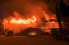 In this photo provided by the Glynn County Fire Department, the house of Hall of Fame golfer Davis Love III is destroyed by fire early Friday morning, March 27, 2020, on St. Simons Island, Ga., in a blaze that could not be controlled, even with 16 firefighters arriving within minutes, the fire chief said. No one from Love's family was injured. (Kyle Jurgens/Glynn County Fire Department via AP)