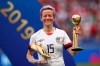FILE - In this Sunday, July 7, 2019 file photo, United States' Megan Rapinoe poses with her individual awards at the end of the Women's World Cup final soccer match between US and The Netherlands at the Stade de Lyon in Decines, outside Lyon, France. The U.S. men's national team urged the U.S. Soccer Federation to sharply increase pay of the American women and accused the governing body of making low-ball offers in negotiations with the men. The union for the women's team filed a gender discrimination lawsuit against the USSF that is scheduled for trial starting May 5. The women agreed to a collective bargaining agreement in April 2017 that extends through 2021. (AP Photo/Francisco Seco, File)