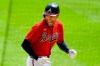 FILE - Atlanta Braves' Freddie Freeman reacts as he runs along the third base line after hitting a grand slam home run in the sixth inning of a baseball game against the Washington Nationals in Atlanta, in this Sunday, Sept. 6, 2020, file photo. NL MVP Freddie Freeman has followed his big season with the Atlanta Braves with an even more memorable offseason. He and his wife have two baby boys, including one from a surrogate mother. He calls his new babies his “twins with a twist.”(AP Photo/John Amis, File)