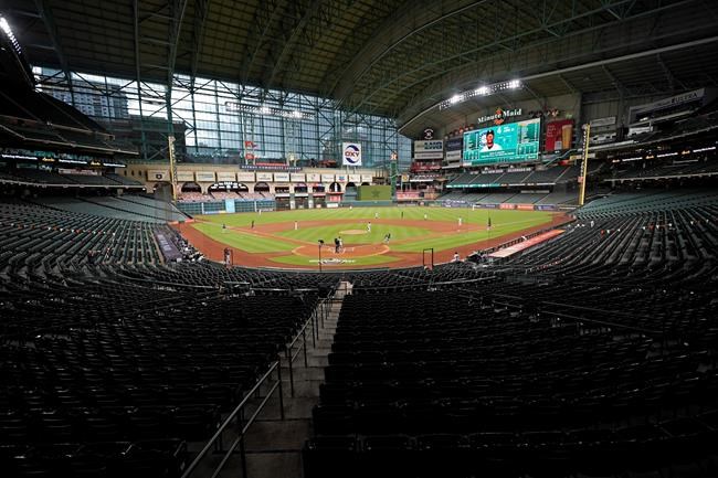 FILE - The Seattle Mariners play the Houston Astros in an empty Minute Maid Park during the first inning of a baseball game Friday, July 24, 2020, in Houston. The Division Series, League Championship Series and World Series will be part of a bubble designed to minimize exposure to the coronavirus. The AL Division Series will be at San Diego's Petco Park and Los Angeles’ Dodger Stadium, and the NL Division Series at Arlington's Globe Life and Houston’s Minute Maid Park. (AP Photo/David J. Phillip, File)
