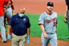 FILE - Washington Nationals starting pitcher Stephen Strasburg, right, walks with a member of the training staff as he heads to the dugout after leaving the game during the first inning of a baseball game against the Baltimore Orioles in Baltimore, in this Friday, Aug. 14, 2020, file photo. Nationals general manager Mike Rizzo said Thursday, Feb. 18, 2021, that Strasburg “is in preparation mode not in rehabilitation mode” at spring training after having surgery in 2020. (AP Photo/Julio Cortez, File)
