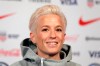 FILE - In this May 24, 2019, file photo, Megan Rapinoe, a member of the United States women's national soccer team, speaks to reporters during a news conference in New York. Seahawks quarterback Russell Wilson, soccer star Megan Rapinoe and three-time WNBA champion Sue Bird will preside over The ESPYS two-hour broadcast airing June 21 on ESPN. All three live in the Seattle area. Rapinoe and Bird are partners who share a household, which conveniently eases some logistics. Wilson‚Äôs singer-wife, Ciara, is likely to make an appearance, too. (AP Photo/Seth Wenig, File)