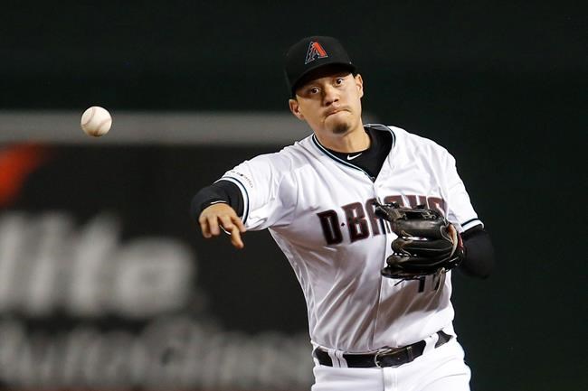 FILE - In this Tuesday, Aug. 20, 2019 file photo, Arizona Diamondbacks second baseman Wilmer Flores (41) in the first inning during a baseball game against the Colorado Rockies, in Phoenix. Versatile infielder Wilmer Flores and the San Francisco Giants finalized a $6.25 million, two-year contract Wednesday, Feb. 12, 2020 as spring training began, giving the club a proven hitter against left-handed pitching. (AP Photo/Rick Scuteri, File)