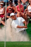 FILE - In this May 13, 2005, file photo, Tiger Woods hits out of a bunker to the 18th green during the second round of the Byron Nelson Championship in Irving, Texas. Woods made bogey to miss the cut, ending his record streak of 142 consecutive cuts made. (AP Photo/Tony Gutierrez, File)