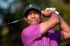 FILE - Tiger Woods watches his tee shot on the first hole during the first round of the PNC Championship golf tournament in Orlando, Fla., in this Dec. 19, 2020, file photo. Woods was injured Tuesday, Feb. 23, 2021, in a vehicle rollover in Los Angeles County and had to be extricated from the vehicle with the “jaws of life” tools, the Los Angeles County Sheriff’s Department said.(AP Photo/Phelan M. Ebenhack, File)
