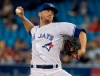 FILE - Toronto Blue Jays pitcher Ken Giles throws to a Boston Red Sox batter during the 10th inning of a baseball game in Toronto, in this Tuesday, Aug. 7, 2018, file photo. The Seattle Mariners finalized a $7 million, two-year contract with reliever Ken Giles on Friday, Feb. 19, 2021, that includes a club option for the 2023 season. Seattle signed Giles knowing he won’t pitch for the Mariners this season while recovering from Tommy John surgery. (Fred Thornhill/The Canadian Press via AP, File)