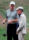 FILE - In this Wednesday, Sept. 5, 2012. file photo, Ernie Els of South Africa, left, laughs with golf course designer Pete Dye during the Pro-Am at the BMW Championship PGA golf tournament at Crooked Stick Golf Club in Carmel, Ind. Golf lost one of its great design architects Thursday, Jan. 9, 2020 when Pete Dye died at age 94. Dye had been battling Alzheimer's disease for several years. His golf courses often were described as “dye-abolical” because of the punishment they could inflict on a bad shot. (AP Photo/Charles Rex Arbogast, File)