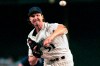 FILE - In this July 15, 2000, file photo, Arizona Diamondbacks' Randy Johnson delivers a pitch during the first inning of a baseball game against the Texas Rangers in Phoenix. Johnson was 10-1 with 139 strikeouts through his first 13 starts over Arizona's first 60 games in 2000, when he won the second of his four consecutive NL Cy Young Awards. (AP Photo/Roy Dabner, File)