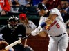 FILE - In this Oct. 22, 2011, file photo, St. Louis Cardinals' Albert Pujols hits a solo home run during the ninth inning of Game 3 of baseball's World Series against the Texas Rangers, in Arlington, Texas. Pujols was drafted in the 13th round in 1999. He was in the majors by 2001, when he won Rookie of the Year honors and drove in 130 runs. Three MVP awards later, Pujols is closing in on the end of his career — with 656 home runs and counting. (AP Photo/Eric Gay, File)